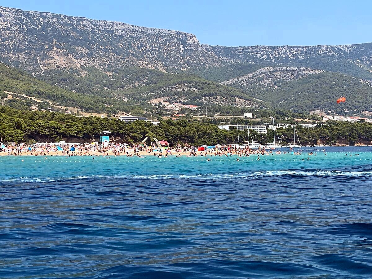 Zlatni Rat beach and Bol town seen from the sea