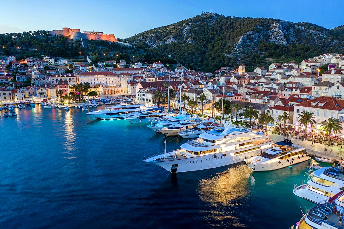 Hvar town harbour with historic buildings and church tower