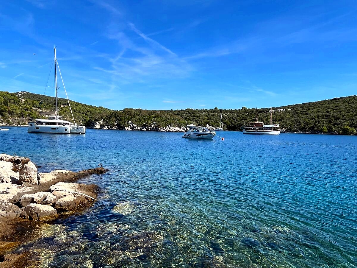Finnmaster boat anchored in a sheltered cove near Šolta