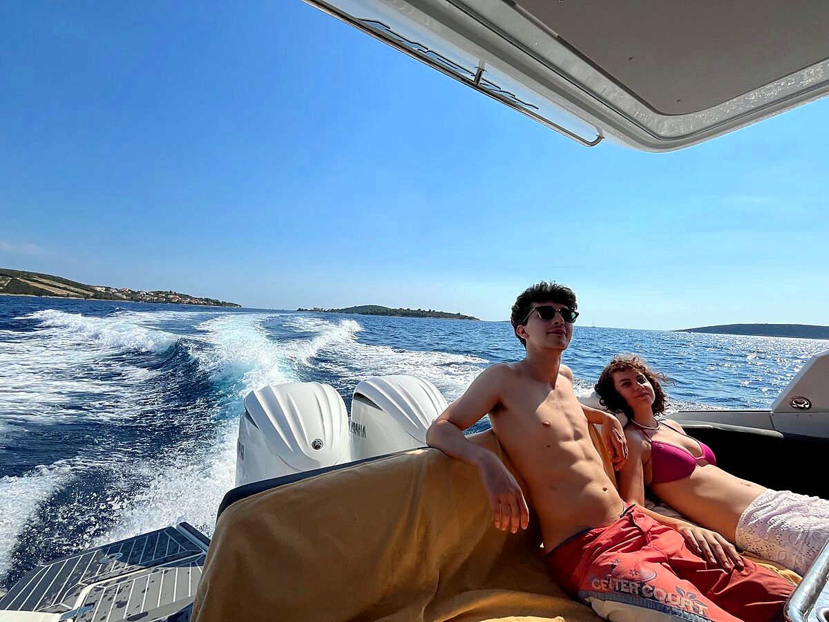 Guests relaxing on the boat while cruising along the Croatian coast